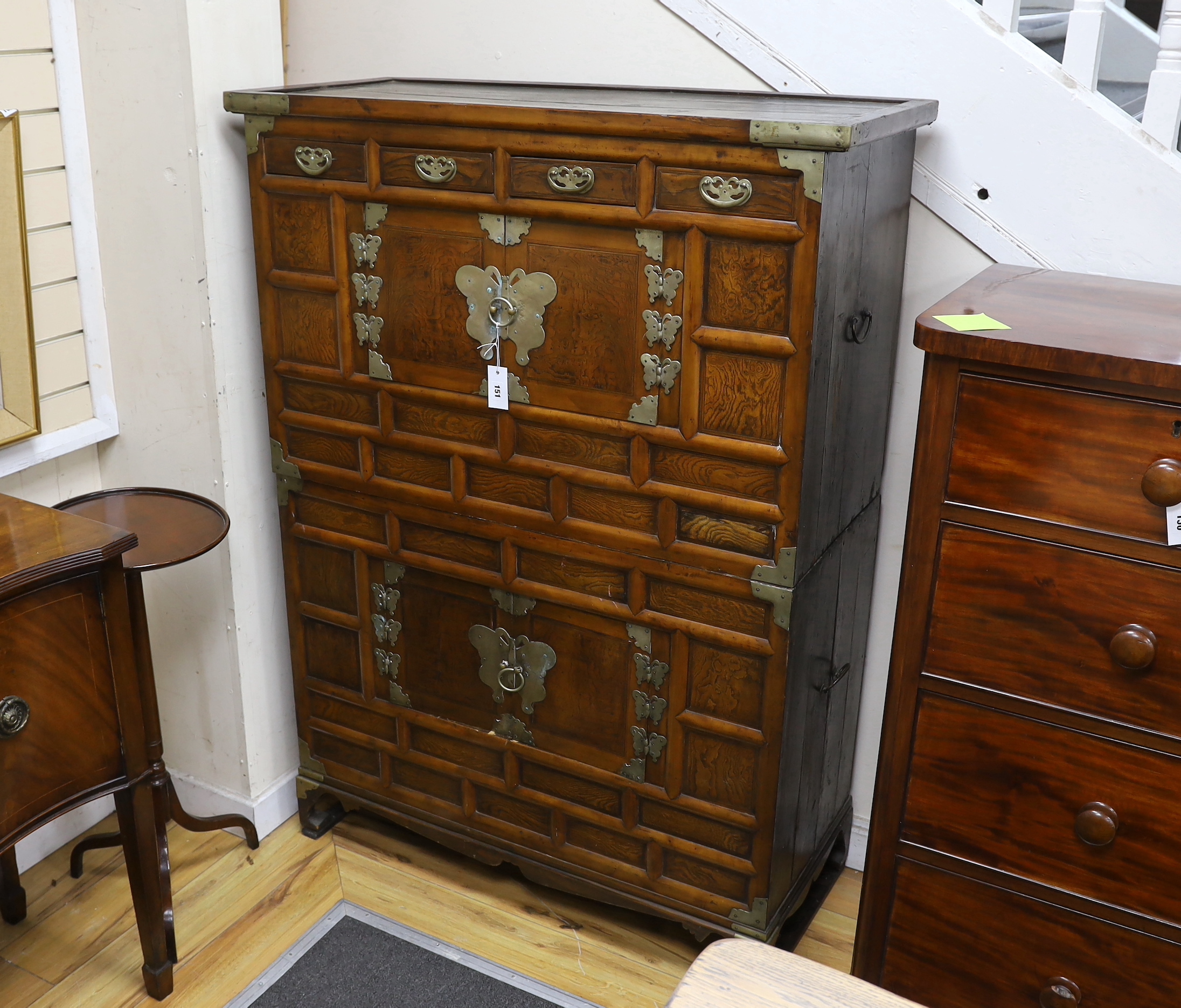A Korean gilt metal mounted elm two part side cabinet, width 108cm, depth 46cm, height 149cm